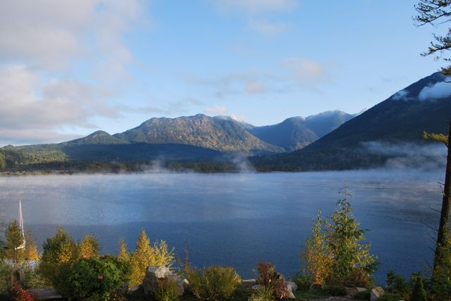 Morning mist over a lake and mountains near Victoria, BC